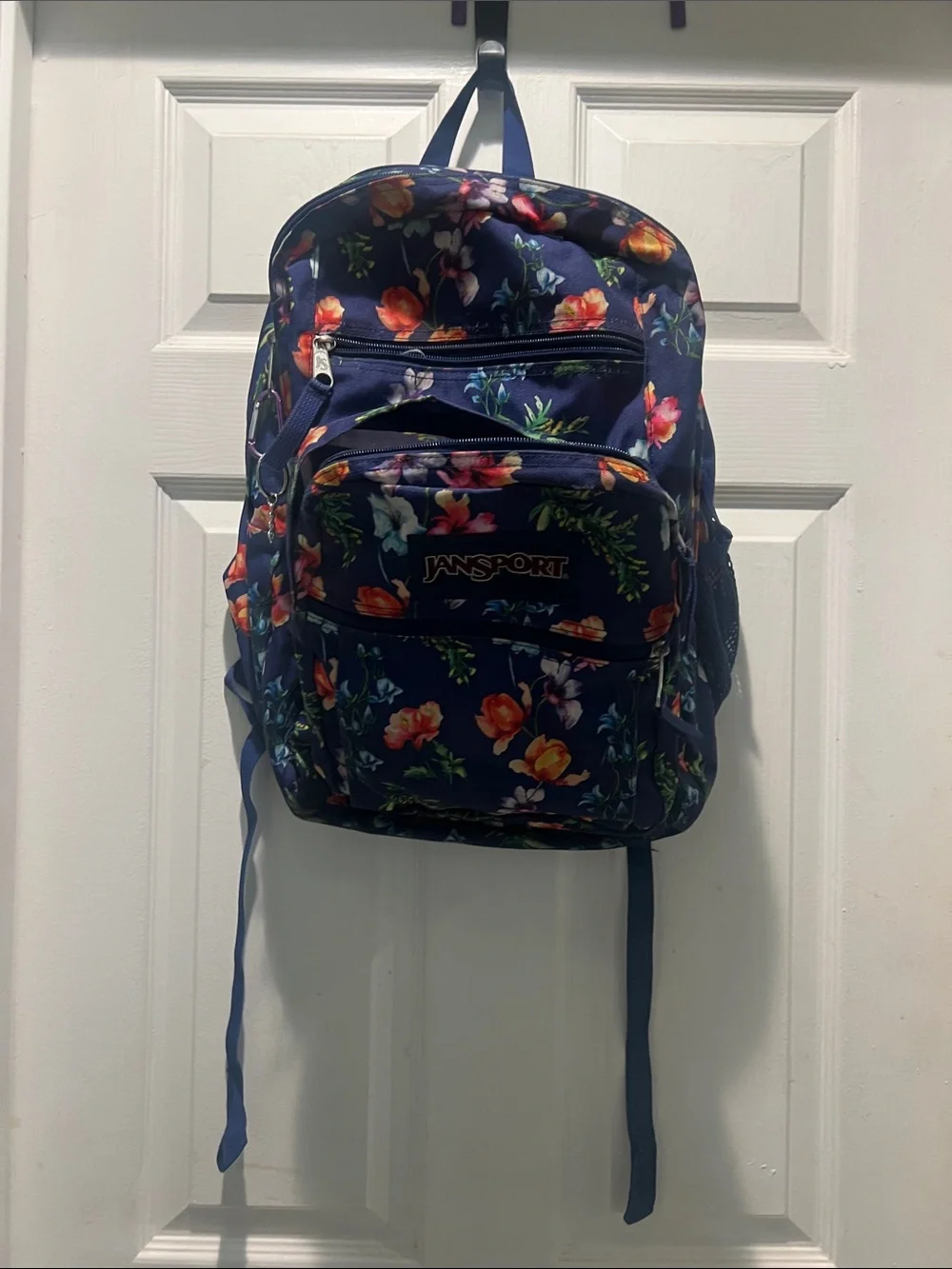 Jansport Navy Backpack with Colorful Floral Print